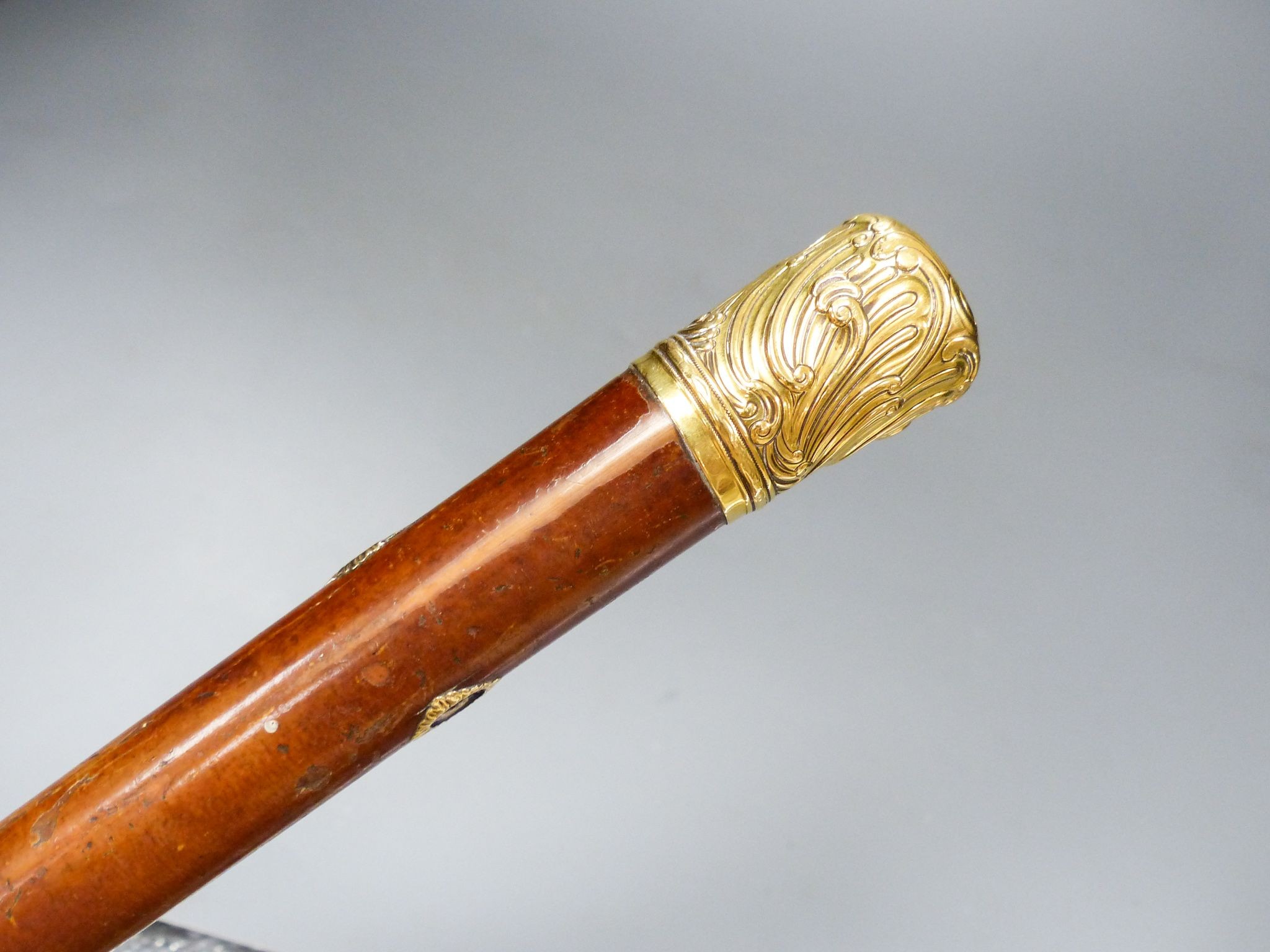 A long George III gold mounted malacca cane, 110.5 cm